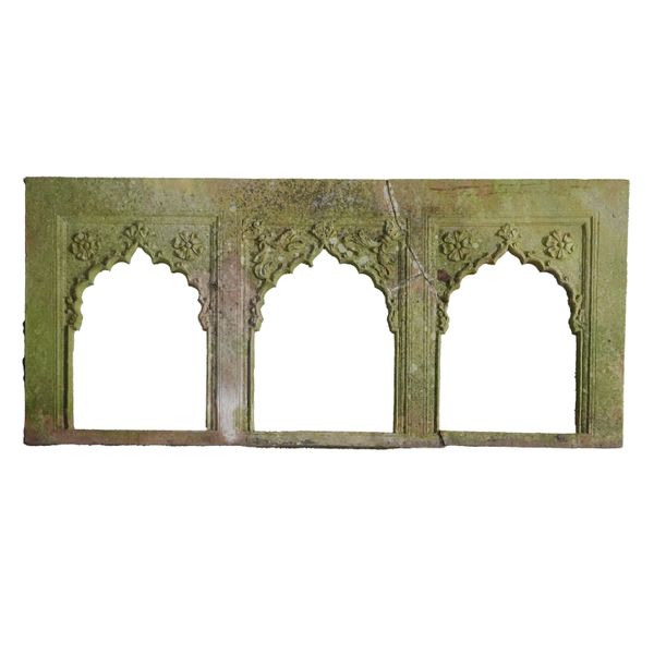 AN INDIAN CARVED SANDSTONE TRIPLE ARCH FRAME OR JALI SCREEN