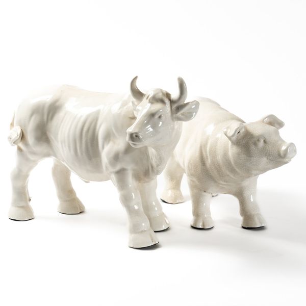 A WHITE GLAZED CERAMIC FIGURE OF A BULL (2)