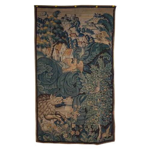 A NORTH EUROPEAN VERDURE TAPESTRY SECTION DEPICTING A WILD BOAR HUNT