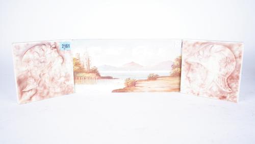 A PAIR OF MOTTLED GLAZE SQUARE TILES EACH DESIGNED WITH A CLASSICAL HEAD  (3)