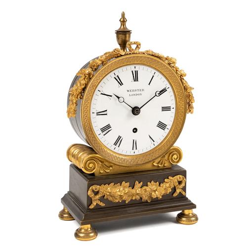 A REGENCY GILT-BRASS AND BRONZED MANTEL TIMEPIECE