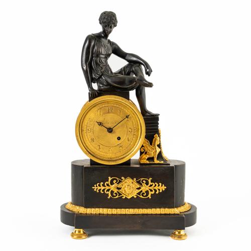 A REGENCY ORMOLU AND BRONZE MANTEL CLOCK