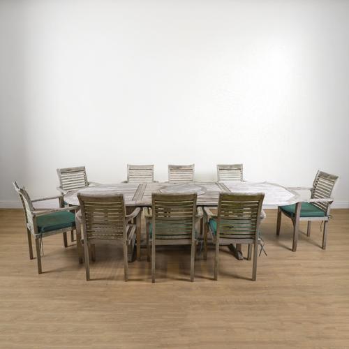 A HARDWOOD OVAL EXTENDING GARDEN TABLE (10)