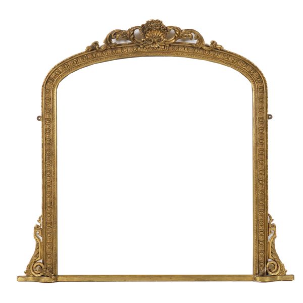 A VICTORIAN GILT FRAMED ARCHED TOP OVERMANTEL MIRROR