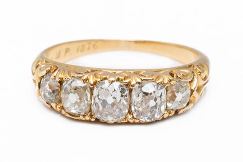 A DIAMOND FIVE STONE RING