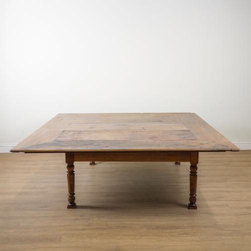 A LARGE WALNUT SQUARE KITCHEN TABLE