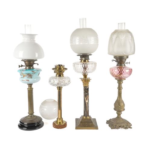 A PARCEL-GILT AND BRASS MOUNTED MARBLEISED GLASS TABLE OIL LAMP (4)