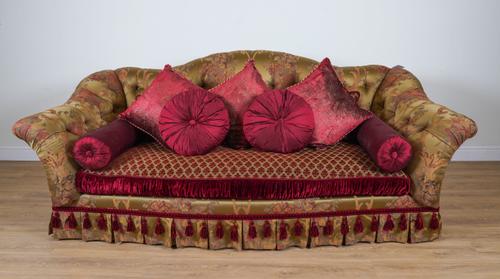 PROVASI: A LARGE GREEN/GOLD FLORAL SILK UPHOLSTERED BUTTON BACK SOFA