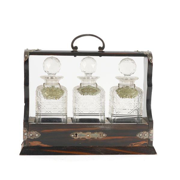 AN EDWARDIAN COROMANDEL SILVER-PLATED THREE BOTTLE TANTALUS