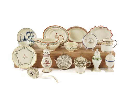 A COLLECTION OF ENAMELLED CREAMWARE (18)
