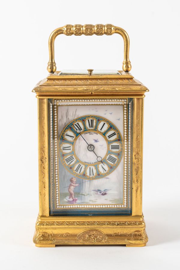 A FRENCH ENGRAVED GILT BRASS THREE-PANEL PORCELAIN STRIKING AND REPEATING CARRIAGE CLOCK