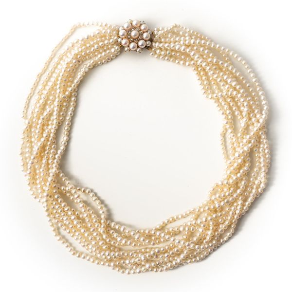 A TEN ROW NECKLACE OF SEED PEARLS ON A 9CT GOLD AND CULTURED PEARL CLUSTER CLASP