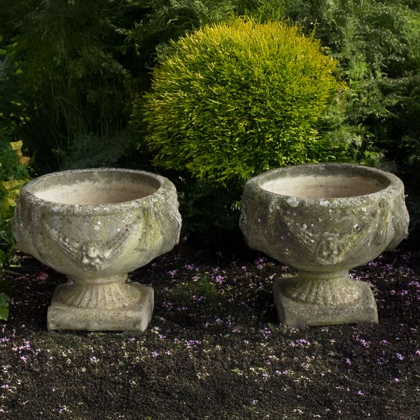 A PAIR OF RECONSTISTUTED STONE JARDINIERES (2)