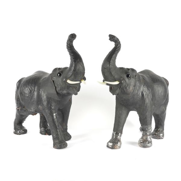 A PAIR OF BLACK LEATHER MODELS OF ELEPHANTS (2)