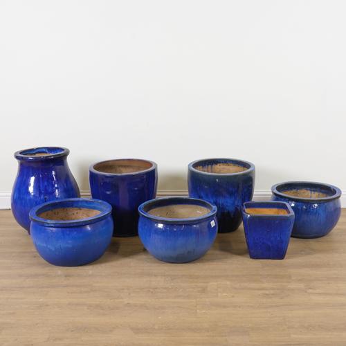A GROUP OF SEVEN BLUE GLAZED GARDEN POTS (7)