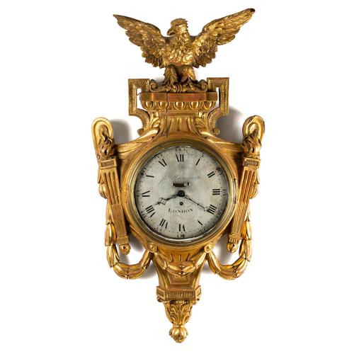 A REGENCY GILTWOOD CARTEL VERGE WALL CLOCK