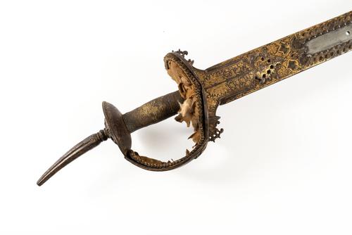 AN INDIAN FIRANGI SWORD WITH DECORATED KHANDA-TYPE HILT