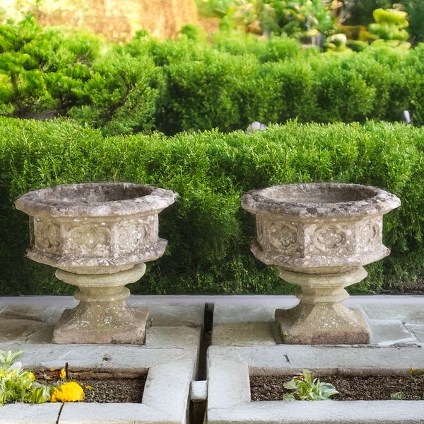 PROBABLY HADDENSTONE; A PAIR OF GOTHIC REVIVAL OCTAGONAL PLANTERS (2)