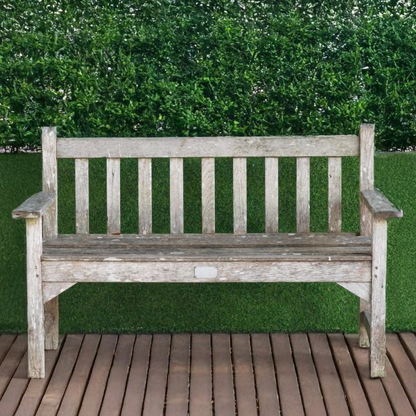 A 20TH CETURY SLATTED HARDWOOD GARDEN BENCH