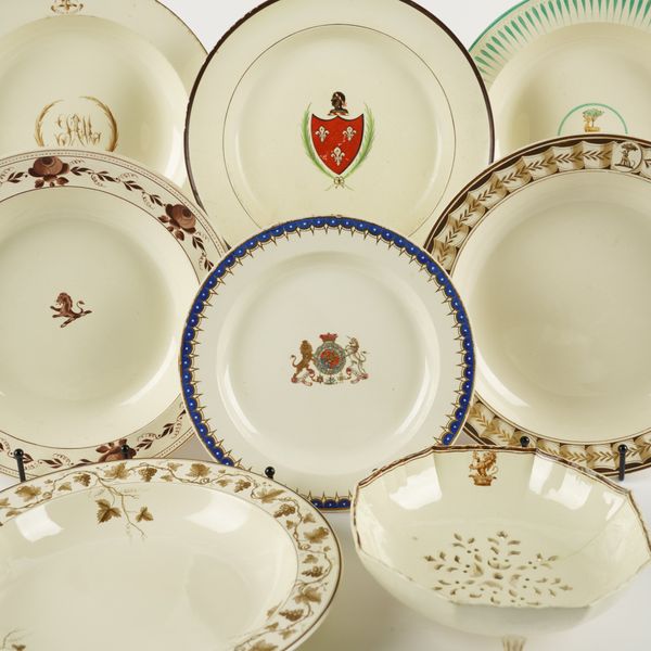 EIGHT PIECES OF ARMORIAL OR CRESTED CREAMWARE (8)