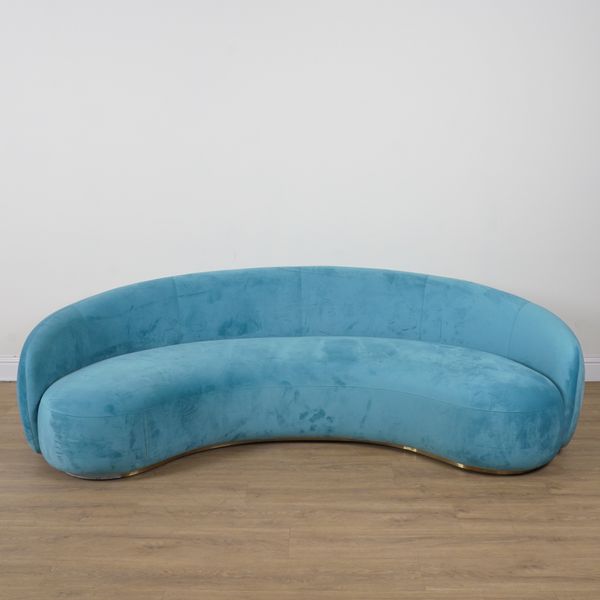 A MODERN CONCAVE BLUE UPHOLSTERED SOFA