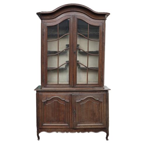 AN EARLY 19TH CENTURY FRENCH OAK BONNET TOPPED DRESSER