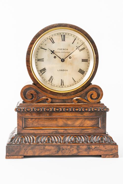 A VICTORIAN WALNUT DRUM-TOP STRIKING MANTEL CLOCK