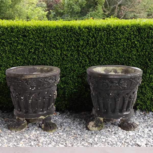 A PAIR OF BLACK PAINTED RECONSTITUTED STONE GARDEN POTS (2)