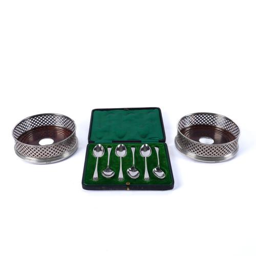 A PAIR OF SILVER MOUNTED BOTTLE COASTERS AND A SET OF SIX SILVER COFFEE SPOONS (3)
