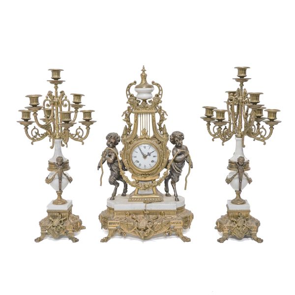 AN ITALIAN LOUIS XVI STYLE GILT-METAL MOUNTED MARBLE CLOCK GARNITURE (3)