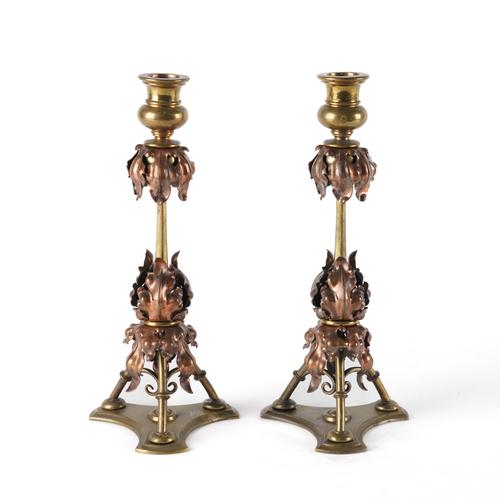 IN THE MANNER OF W.A.S BENSON, A PAIR OF COPPER AND BRASS CANDLESTICKS