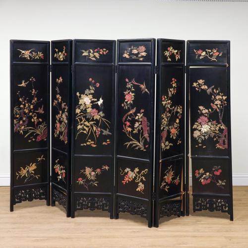 AN EARLY 20TH CENTURY CHINESE EXPORT BLACK LACQUER SIX FOLD SCREEN