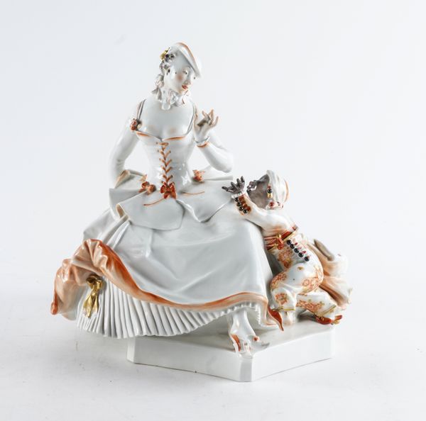 A MEISSEN FIGURE OF A LADY WITH A MOOR ATTENDANT