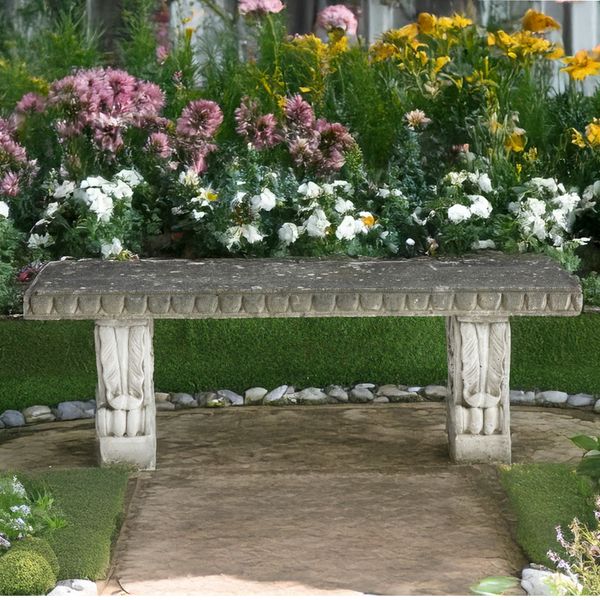 A RECONSTITUTED STONE BENCH