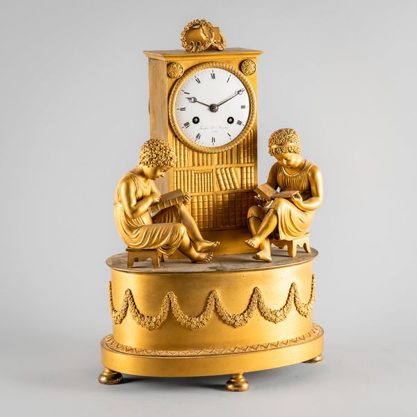 AN EMPIRE ORMOLU MANTEL CLOCK