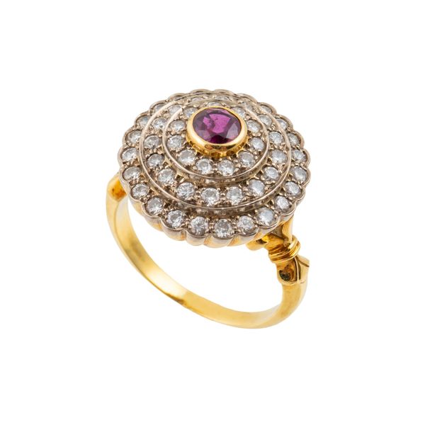 A DIAMOND AND RUBY CLUSTER RING