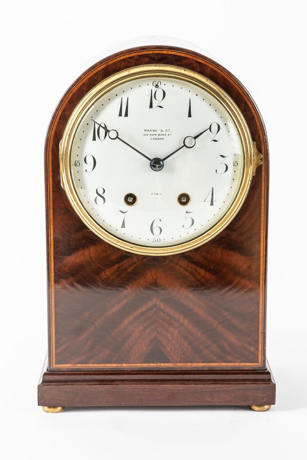 AN EDWARDIAN MAHOGANY AND LINE INLAID LIBRARY CLOCK