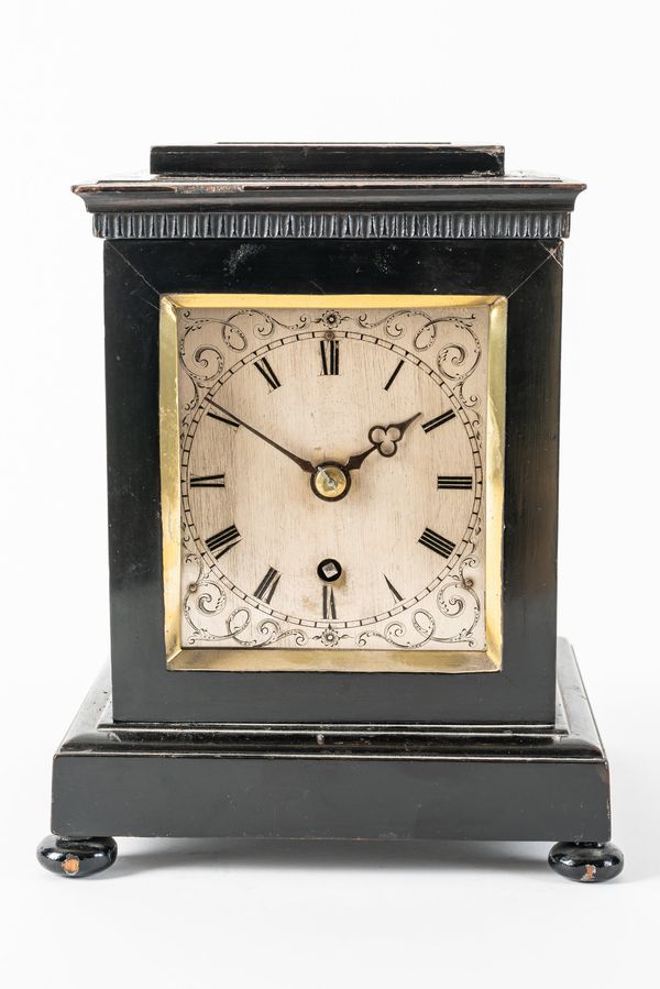 AN EARLY VICTORIAN SMALL EBONISED MANTEL TIMEPIECE