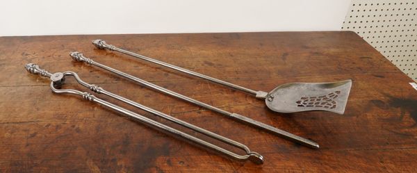 A GEORGE III STYLE THREE PIECE SET OF POLISHED STEEL FIRE TOOLS (3)