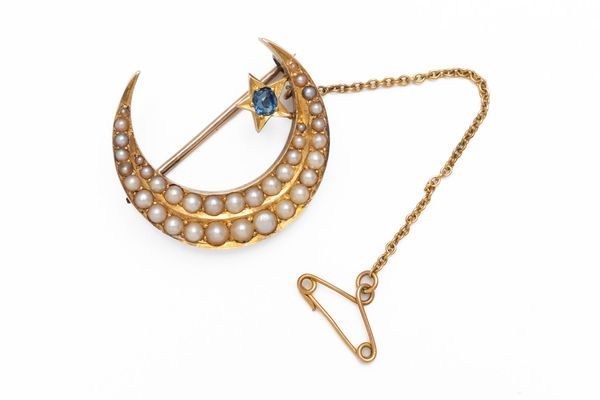 A HALF PEARL AND SAPPHIRE CRESCENT MOON BROOCH