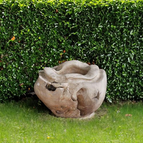 A MODERN NATURALISTIC DUG OUT HARDWOOD PLANTER