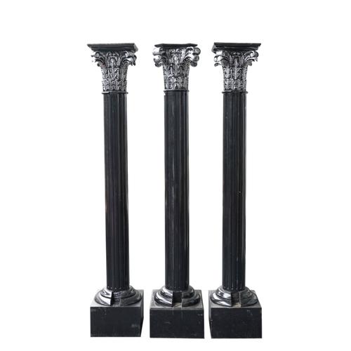 A SET OF THREE BLACK AND SILVER PAINTED CORINTHIAN COLUMNS (3)