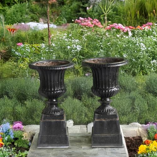 A PAIR OF LATE 19TH CENTURY BLACK PAINTED CAST IRON GARDEN URNS (2)