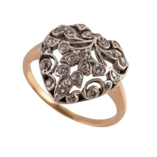 A GOLD AND SILVER SET HEART SHAPED RING