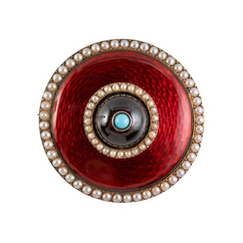 A CIRCULAR ENAMEL BROOCH