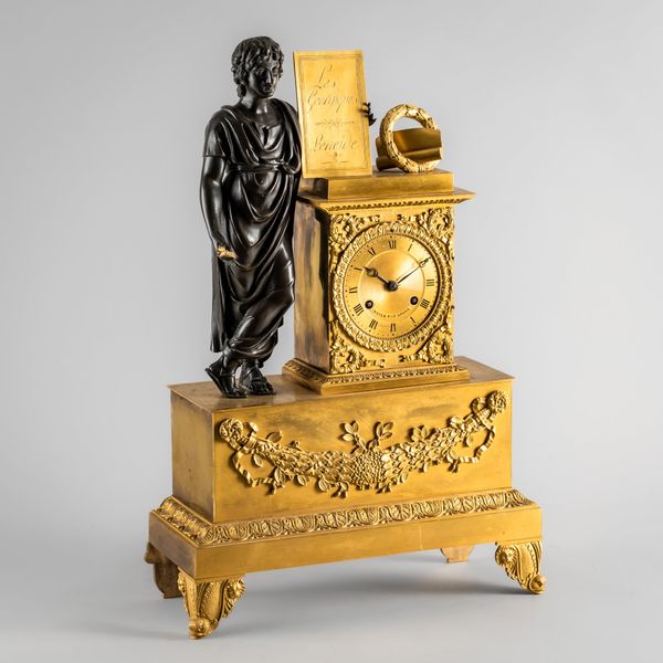 AN EMPIRE ORMOLU AND BRONZE MANTEL CLOCK