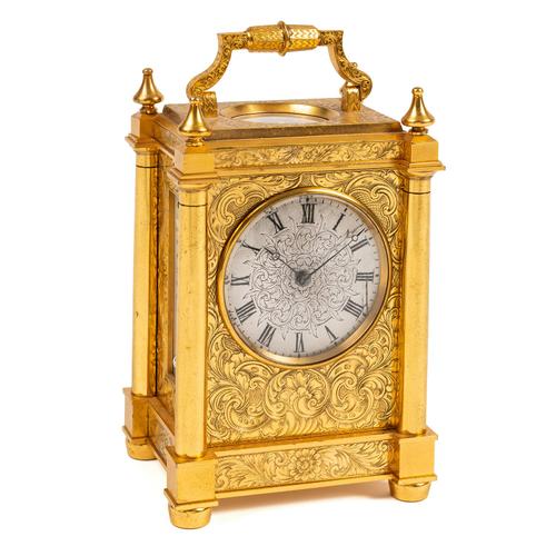 AN ENGLISH GILT-BRASS CARRIAGE TIMEPIECE WITH COMPASS AND THERMOMETERS
