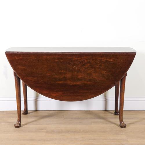 A GEORGE II MAHOGANY OVAL DROP FLAP TABLE
