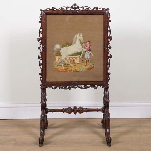 A VICTORIAN WALNUT FRAMED FIRE SCREEN