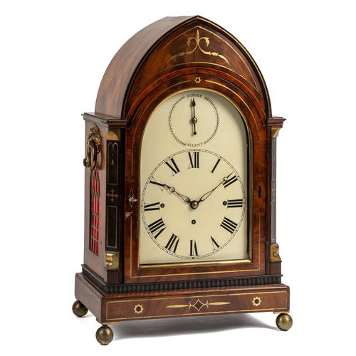A REGENCY LANCET-SHAPED MAHOGANY BRASS-INLAID QUARTER STRIKING AND REPEATING BRACKET CLOCK